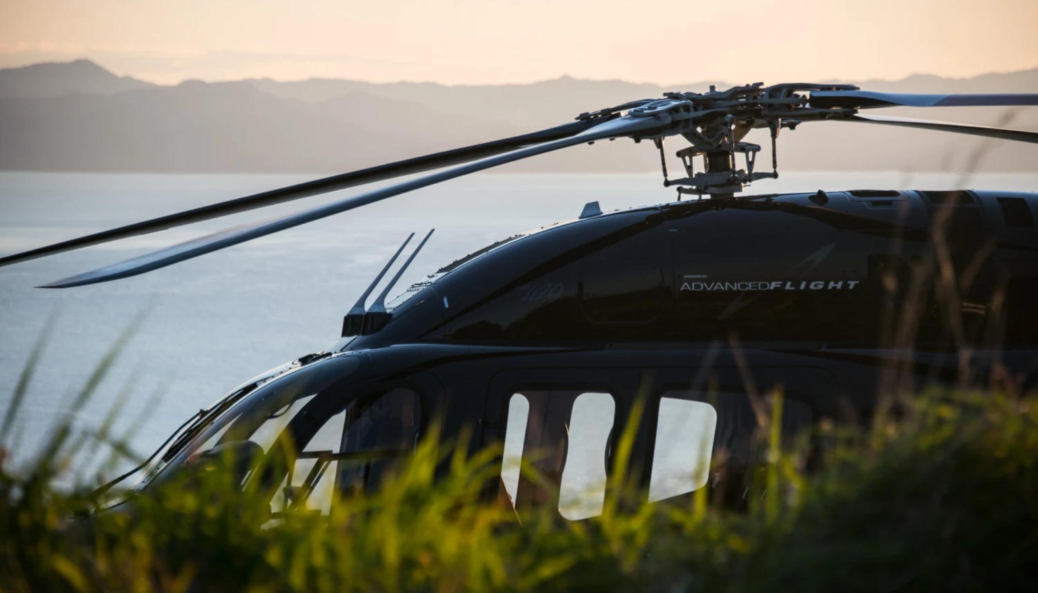 Advanced Flight helicopter at sunset